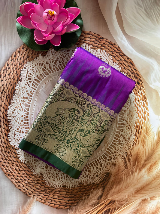Decorative purple and green fabric with floral design